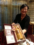 Madame Xu and a bottle of very good rice wine